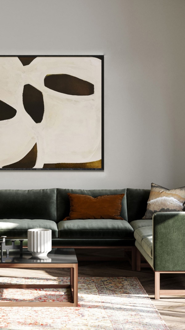 A room set featuring a modular Orten sofa, upholstered in dark green fabric, by Lyndon.