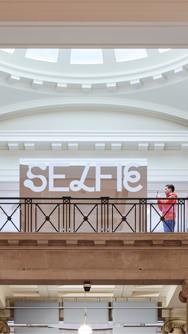 An interior photograph of National Museum Cardiff showing the 'Selfie' mirror box.